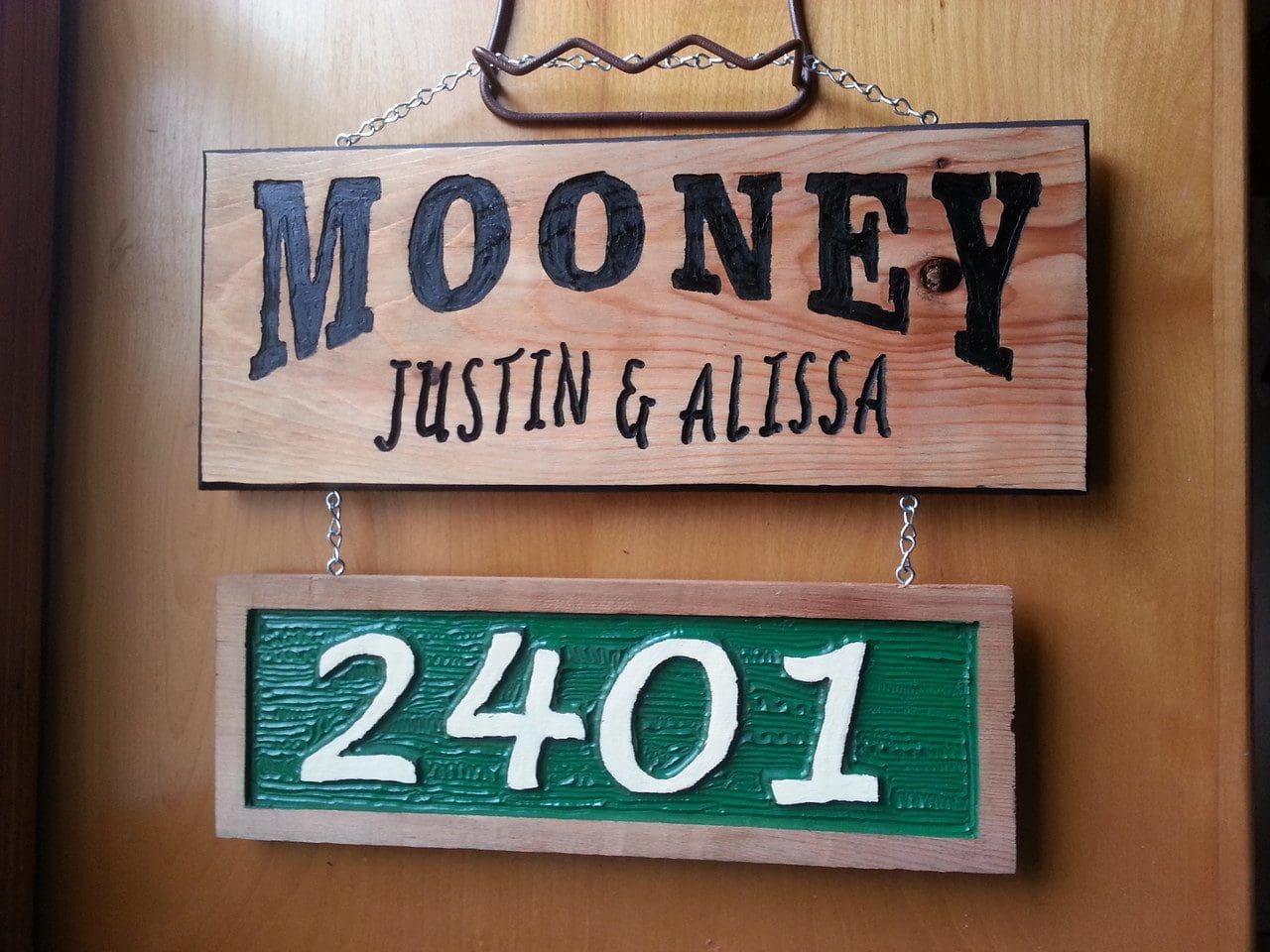 Wooden sign with "Mooney" and "2401".