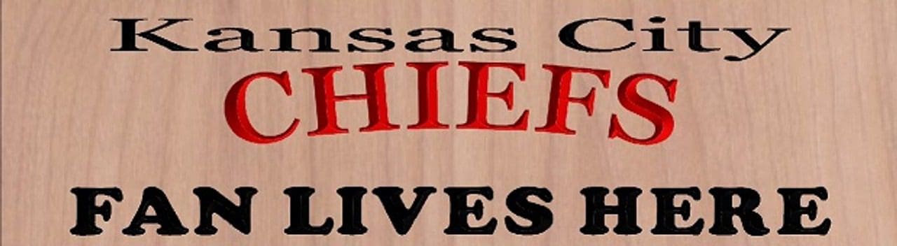 Kansas City Chiefs fan sign on wood.