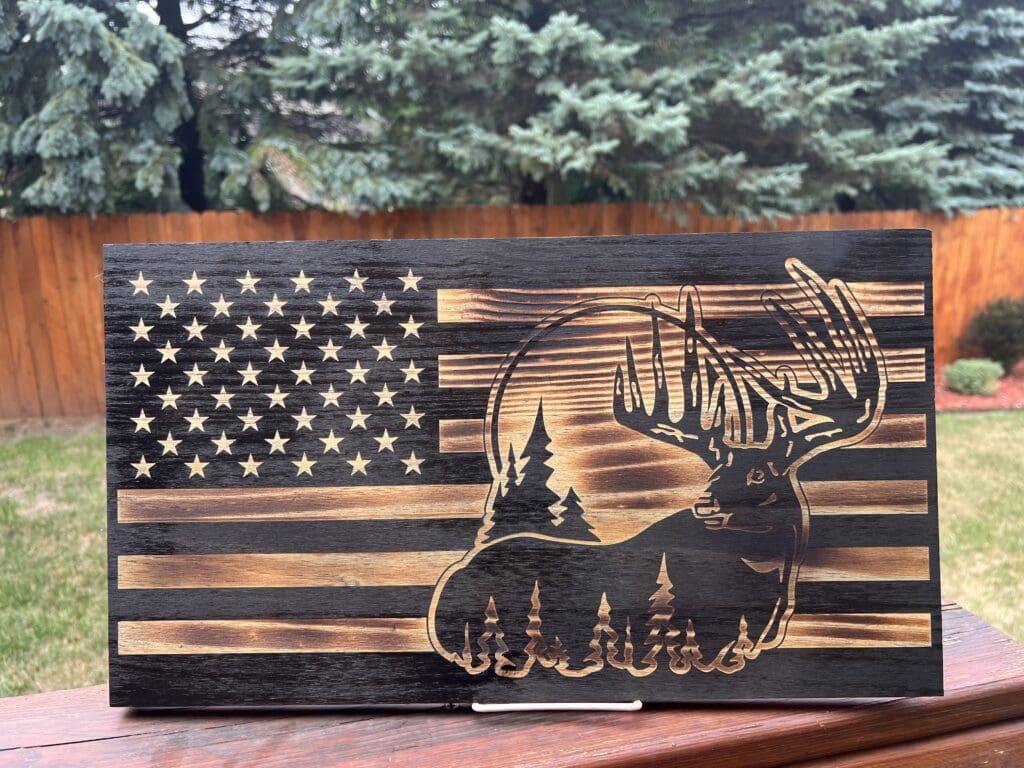 Wooden American flag with wildlife and nature carvings.